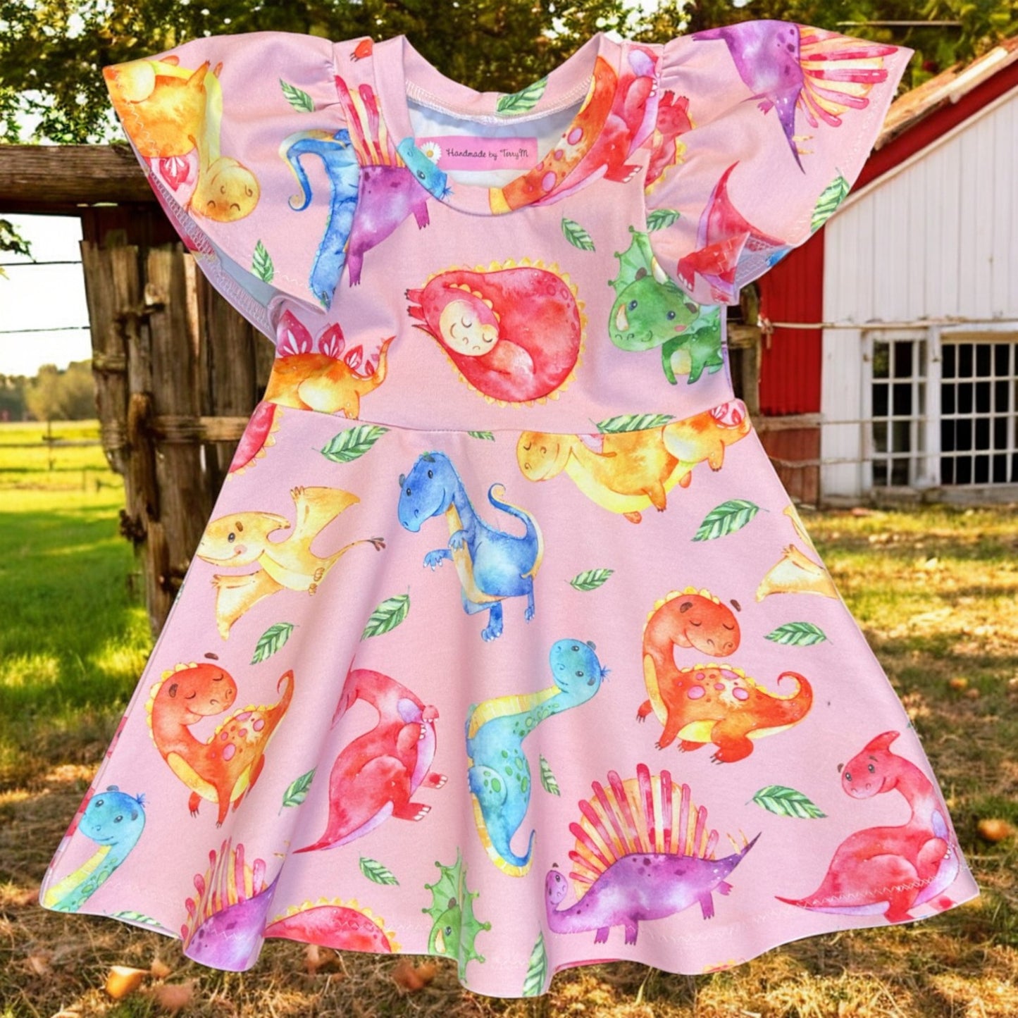 “Pink dinosaur baby dress – size 1”
“Handmade colourful dino skater dress”
