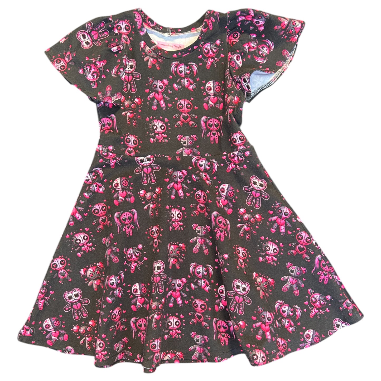Pink voodoo doll girls dress size 5”
“Handmade quirky pink dress
