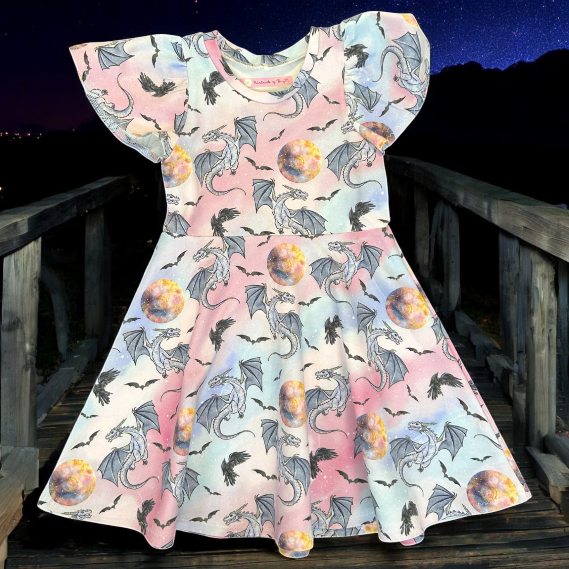Purple dragon girls dress – size 4
Handmade dragon skater dress
