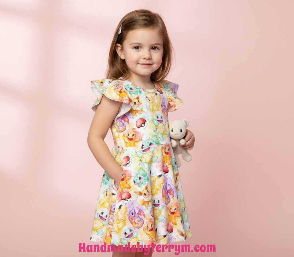 Young girl wearing a colourful dress with pokemon print