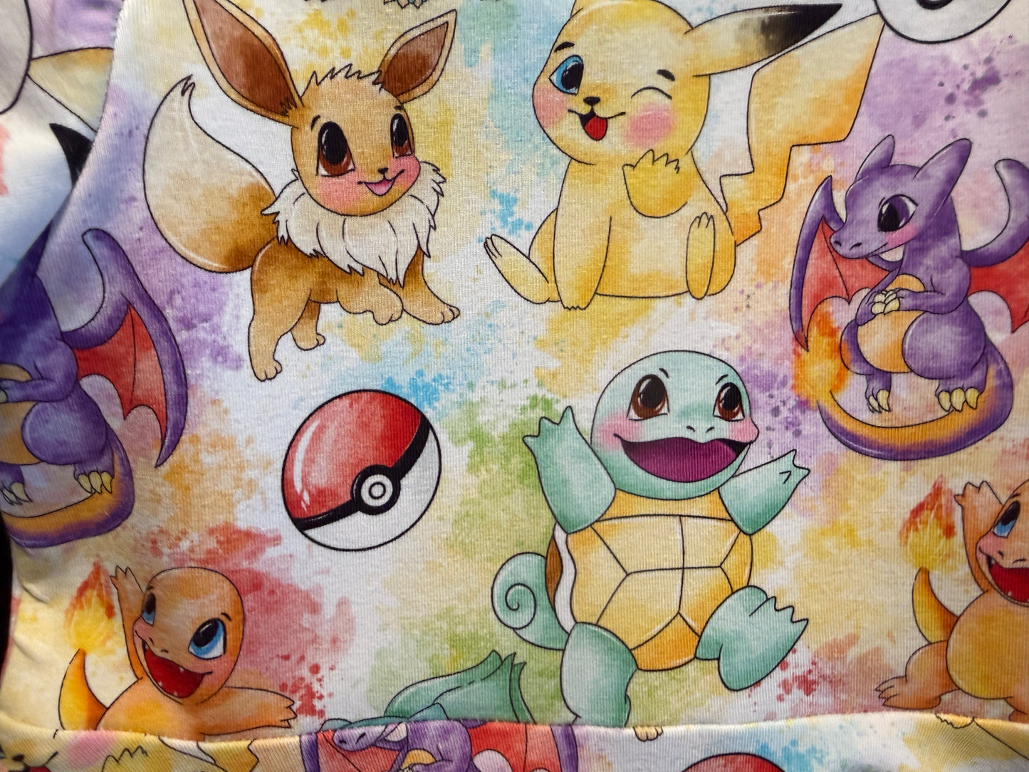  colorful pokemon pattern on a pale yellow