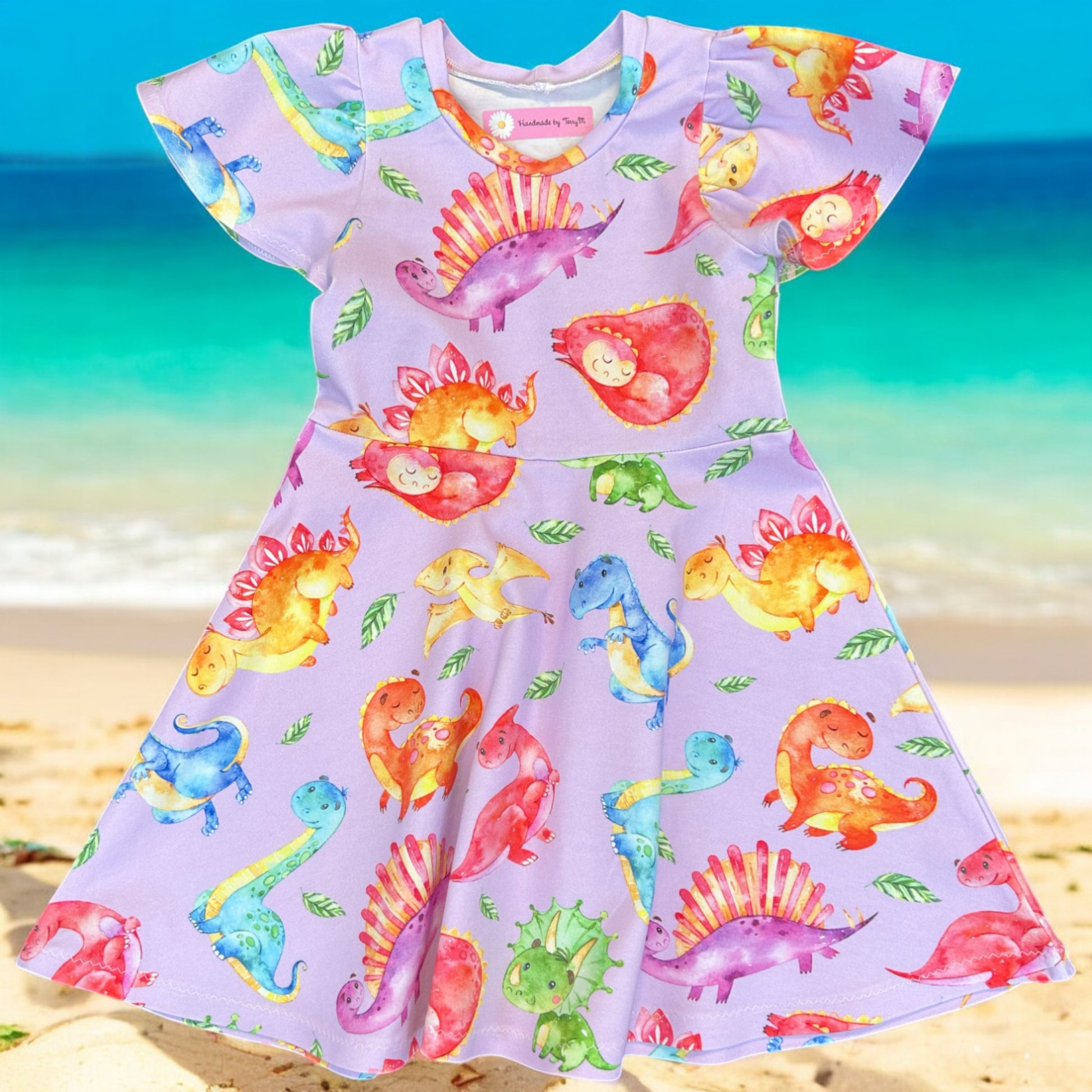 Lilac dinosaur girls dress – size 4
Handmade colourful dino skater dress
