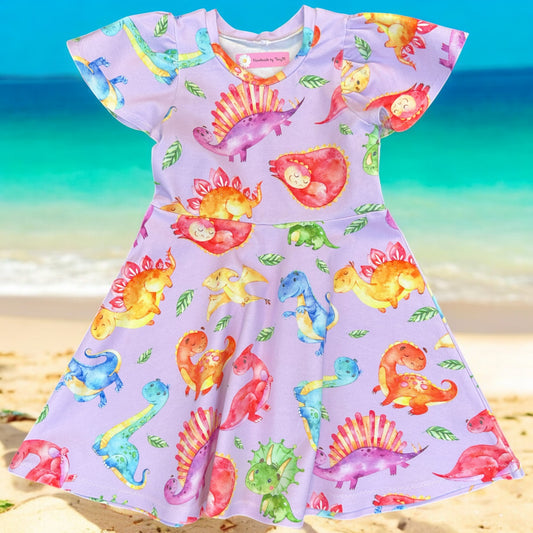 Lilac dinosaur girls dress – size 4
Handmade colourful dino skater dress
