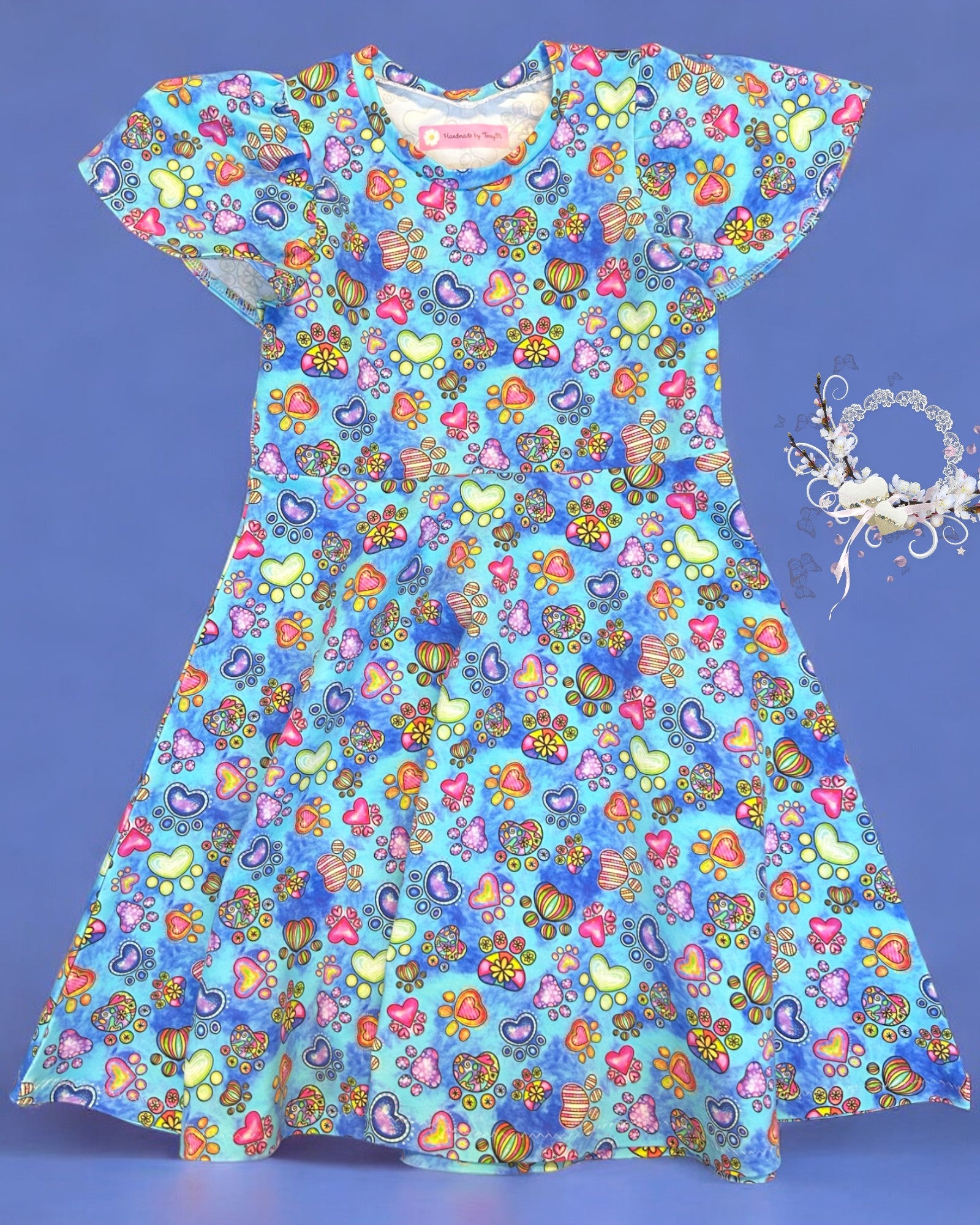 Blue paw print girls dress – size 7
Handmade animal print skater dress