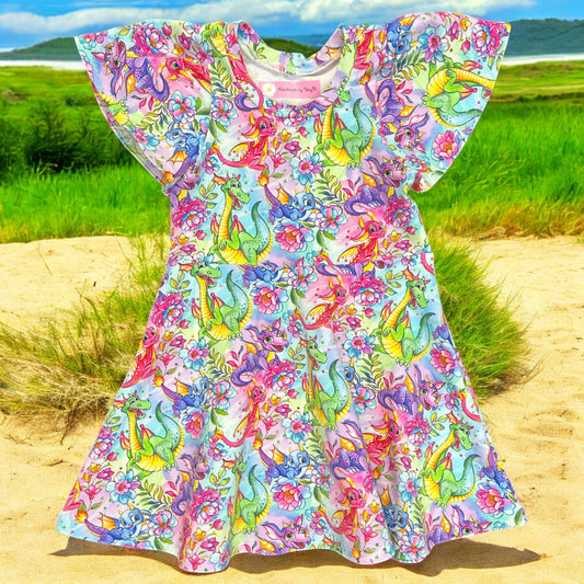 Rainbow dragon girls dress – size 2
Handmade colourful dragon skater dress
